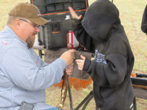 Isac showing how to load muzzle loading rifle