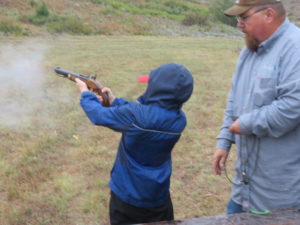 young man shooting pistol
